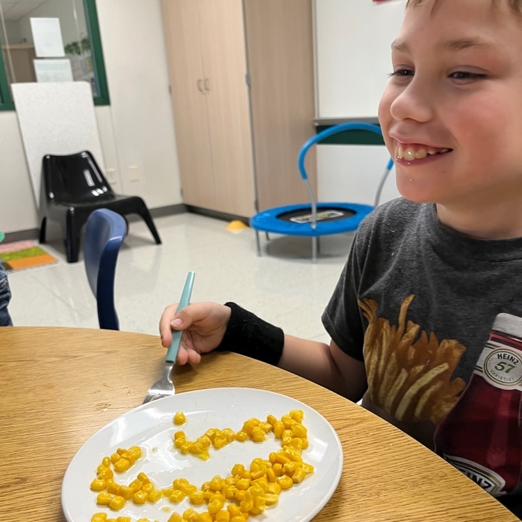 student enjoying corn